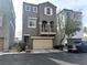 Attractive two-story home features a balcony, a two-car garage, and desert landscaping at 9535 Leaping Lizard St, Las Vegas, NV 89178