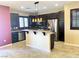 Inviting kitchen featuring granite countertops, an island, and stainless steel appliances at 9535 Leaping Lizard St, Las Vegas, NV 89178
