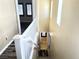 Hallway and staircase featuring wood-look flooring and white banister at 9535 Leaping Lizard St, Las Vegas, NV 89178