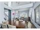 Open-concept living room with dining area featuring high ceilings and ample natural light at 9709 Terrace Green Ave, Las Vegas, NV 89117