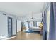 Bright main bedroom boasts a vaulted ceiling, a ceiling fan, wood flooring, and backyard access at 9709 Terrace Green Ave, Las Vegas, NV 89117