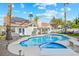 Backyard view featuring a pristine pool, outdoor seating, and solar panels on the home's roof at 9709 Terrace Green Ave, Las Vegas, NV 89117