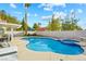 The backyard features a refreshing pool and spa combo, ideal for relaxation and enjoying sunny days at 9709 Terrace Green Ave, Las Vegas, NV 89117