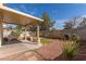 A serene backyard showcases desert landscaping, a covered patio and privacy walls at 10103 Flagstaff Butte Ave, Las Vegas, NV 89148