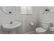 Powder room with toilet and sink, neutral paint, updated fixtures and tile flooring at 10103 Flagstaff Butte Ave, Las Vegas, NV 89148