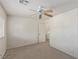 Bedroom featuring neutral walls and carpet, ceiling fan, and window for bright living space at 10103 Flagstaff Butte Ave, Las Vegas, NV 89148