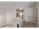Bright upper hallway with neutral walls and carpet, leading to multiple rooms at 10103 Flagstaff Butte Ave, Las Vegas, NV 89148