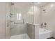 Bathroom walk-in shower with neutral wall and tile surround, modern fixtures, and glass partition at 10103 Flagstaff Butte Ave, Las Vegas, NV 89148