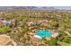 Aerial view shows a luxurious community pool and lush landscaping at 10290 Profeta Ct, Las Vegas, NV 89135