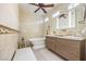 Modern bathroom features a standalone tub and sleek vanity at 10290 Profeta Ct, Las Vegas, NV 89135