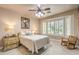Cozy bedroom with a comfortable bed and charming decor, filled with natural light at 10290 Profeta Ct, Las Vegas, NV 89135