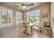 Bright breakfast nook features large window and comfortable seating at 10290 Profeta Ct, Las Vegas, NV 89135