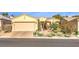Inviting single-story home with a well-manicured front yard, desert landscaping, and attached garage at 10290 Profeta Ct, Las Vegas, NV 89135