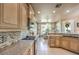Well-appointed kitchen with granite countertops, custom cabinets, and stainless steel appliances, ideal for cooking at 10290 Profeta Ct, Las Vegas, NV 89135