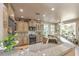 Spacious kitchen featuring upgraded cabinets, granite countertops, and stainless-steel appliances at 10290 Profeta Ct, Las Vegas, NV 89135