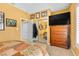 Bedroom featuring a TV, dresser, mirrored closet and doorway at 10920 Black Ledge Ave, Las Vegas, NV 89134