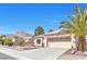 Single story home boasting a neutral exterior, tile roof, desert landscaping, and mountain views at 10920 Black Ledge Ave, Las Vegas, NV 89134