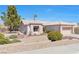 Attractive single-story home with well-maintained landscaping, a tile roof, and an attached two-car garage at 10920 Black Ledge Ave, Las Vegas, NV 89134