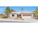 Charming single-story home featuring desert landscaping, tile roof, and an attached two-car garage at 10920 Black Ledge Ave, Las Vegas, NV 89134