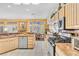 Bright kitchen featuring stainless steel appliances, granite counters, and tile flooring at 10920 Black Ledge Ave, Las Vegas, NV 89134