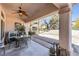 Back patio with ceiling fan, patio furniture, and serene view of desert landscaping at 10920 Black Ledge Ave, Las Vegas, NV 89134