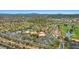 Aerial view of a neighborhood with a recreation center, tennis courts, and lush landscaping at 10921 Grand Haven Ave, Las Vegas, NV 89134