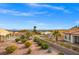 Expansive desert landscaping in backyard, complemented by scenic neighborhood views and mature vegetation at 10921 Grand Haven Ave, Las Vegas, NV 89134