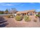 Desert landscaping surrounds the home, creating a low-maintenance and visually appealing outdoor space at 10921 Grand Haven Ave, Las Vegas, NV 89134