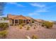 Desert landscaped backyard with a covered patio, offering a serene and low-maintenance outdoor space at 10921 Grand Haven Ave, Las Vegas, NV 89134