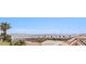 Elevated view shows Las Vegas skyline and desert landscape with palm trees, and terracotta roofs at 10921 Grand Haven Ave, Las Vegas, NV 89134