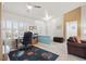 Inviting home office featuring lots of natural light, a ceiling fan, and a practical workspace at 10921 Grand Haven Ave, Las Vegas, NV 89134