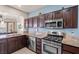 Well-equipped kitchen boasts stainless steel appliances, granite counters, and ample cabinet space at 10921 Grand Haven Ave, Las Vegas, NV 89134