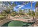 Scenic miniature golf course with trees, shrubs, and well maintained green at 10921 Grand Haven Ave, Las Vegas, NV 89134