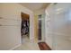 Bathroom featuring a large shower with glass doors and a walk in closet in the background at 1131 Sax Fifth Ave, Henderson, NV 89052