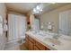 Traditional bathroom featuring double sinks, vanity and framed mirror at 1131 Sax Fifth Ave, Henderson, NV 89052