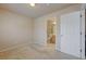 Bedroom with carpet and a door leading to a bathroom at 1131 Sax Fifth Ave, Henderson, NV 89052