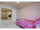 Bedroom featuring bright colored decor and neutral colored walls at 1131 Sax Fifth Ave, Henderson, NV 89052