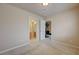 Bedroom with carpet and a door leading to the bathroom and an exercise room at 1131 Sax Fifth Ave, Henderson, NV 89052