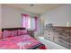 Bedroom featuring bright colored decor, window, and dresser at 1131 Sax Fifth Ave, Henderson, NV 89052