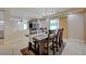 Formal dining room with tile flooring, chandelier, access to living room and back yard at 1131 Sax Fifth Ave, Henderson, NV 89052