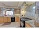 Stylish kitchen with granite countertops, tile backsplash, wooden cabinetry, and modern appliances at 1131 Sax Fifth Ave, Henderson, NV 89052