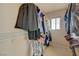 Walk-in closet with clothes hanging on racks and shelves at 1131 Sax Fifth Ave, Henderson, NV 89052