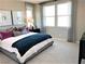 Bedroom showcases a plush bed, ambient lighting, and elegant window treatments at 116 Antler Square Ln, Henderson, NV 89011