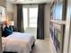 Bedroom features a well-lit space with a large window, neutral colors, and stylish decor at 116 Antler Square Ln, Henderson, NV 89011
