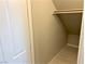 A walk-in closet with hardwood floors and white trim at 116 Antler Square Ln, Henderson, NV 89011