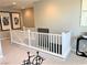 Open second floor hallway, showcasing the carpeted flooring and white railing at 116 Antler Square Ln, Henderson, NV 89011
