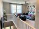 A cozy and stylish living room area features a modern design with carpeted floors and windows at 116 Antler Square Ln, Henderson, NV 89011