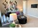 Comfortable living area with a grey sectional sofa and geometric wall art at 116 Antler Square Ln, Henderson, NV 89011