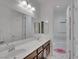 Bright bathroom features double sinks, large mirrors, and shower/tub combo at 12249 Catanzaro Ave, Las Vegas, NV 89138