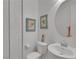 Powder room featuring round mirror and decorative prints at 12249 Catanzaro Ave, Las Vegas, NV 89138